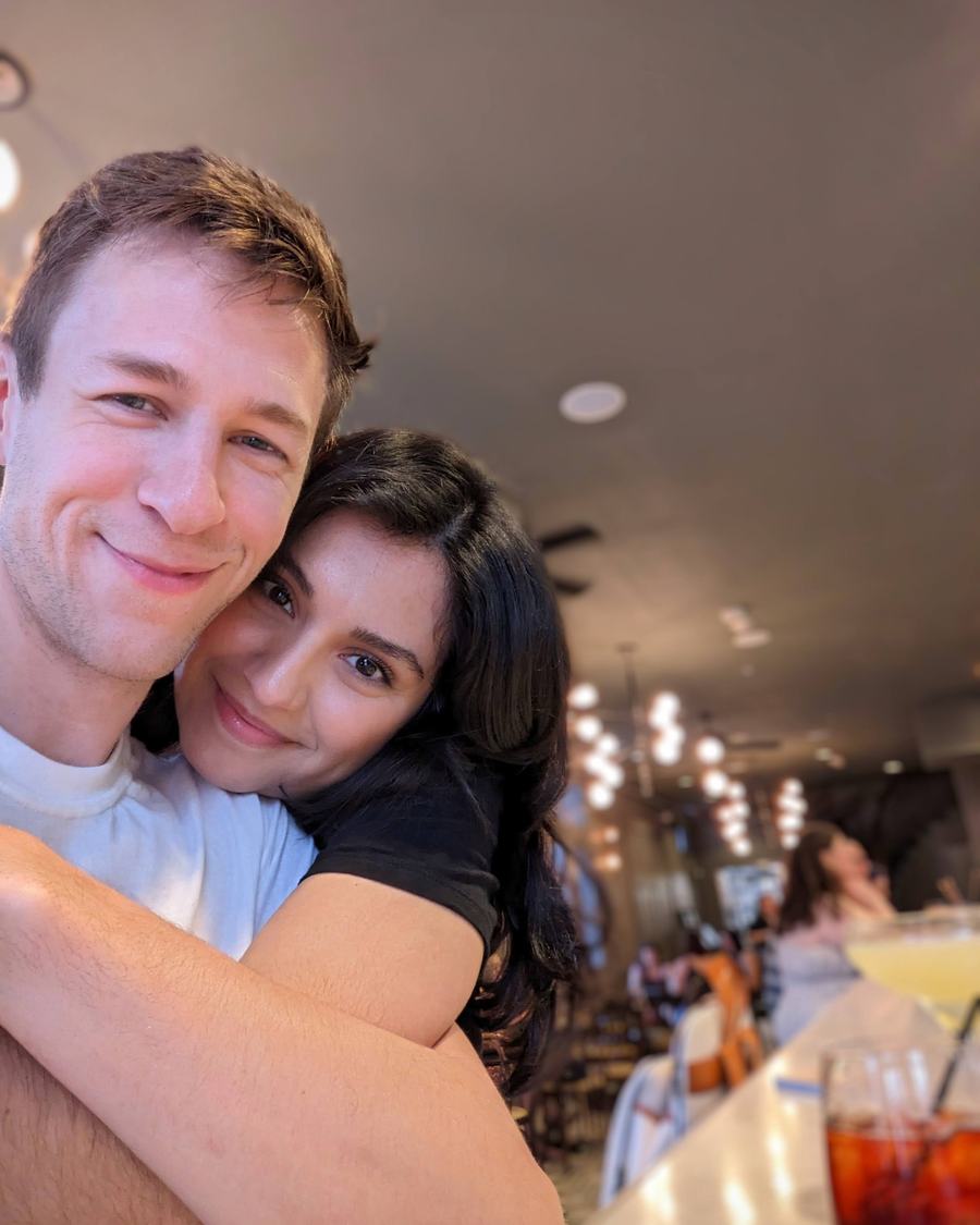 Megan hugging Tyler at a restaurant